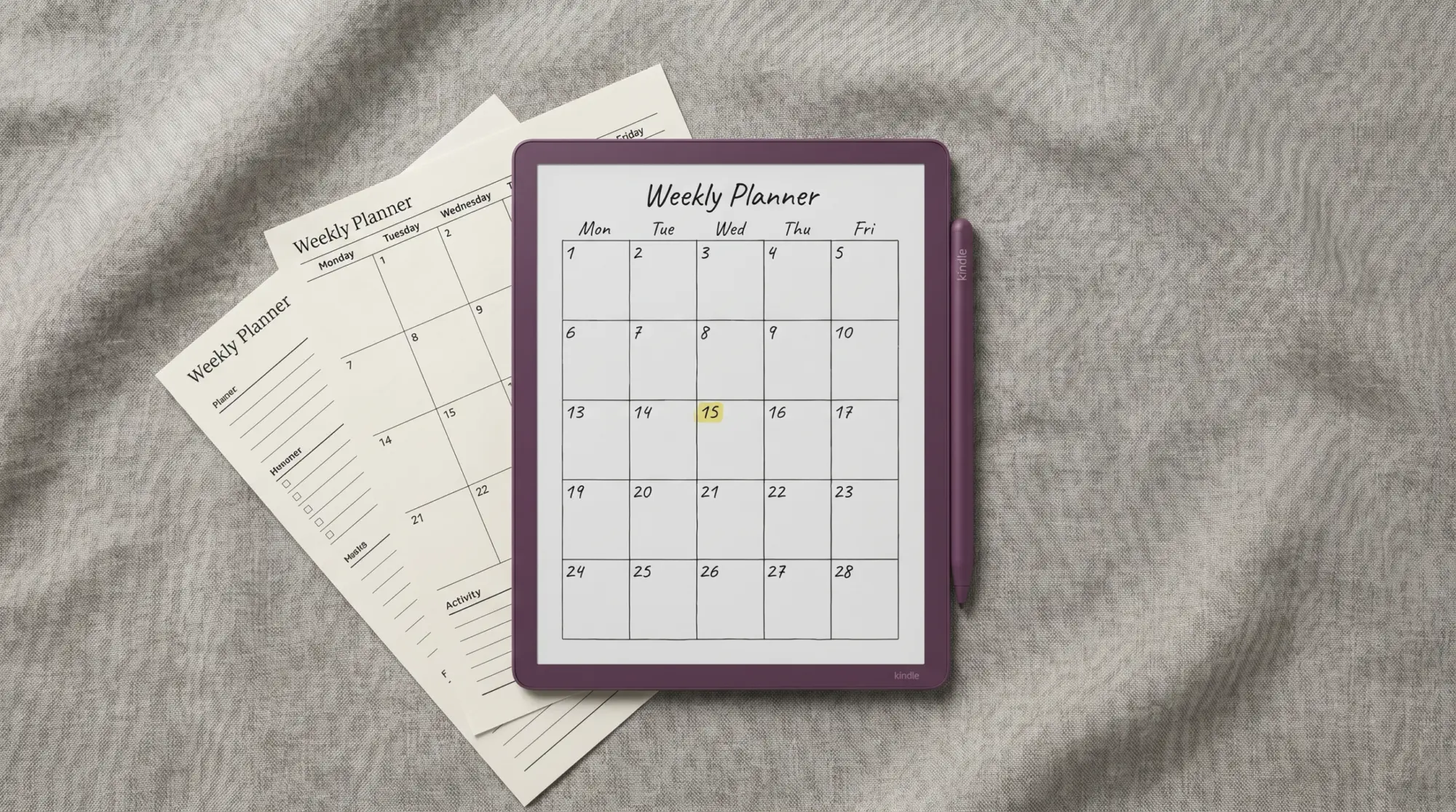 Free Kindle Scribe Colorsoft planner shown on the device beside printable pages