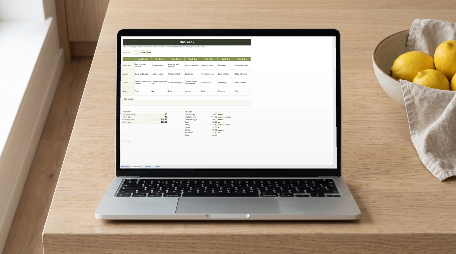Our free meal planner and grocery list for Google Sheets open on a laptop, a seven-day meal grid with the shopping totals below it