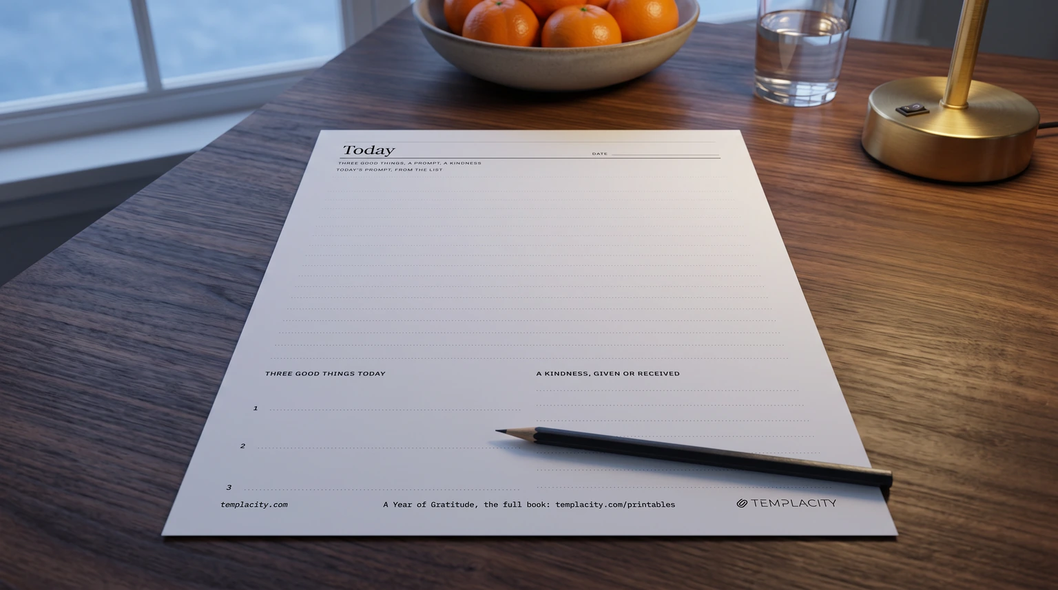Our free printable gratitude journal day page, three good things, a prompt and a kindness, printed on a walnut table at dusk