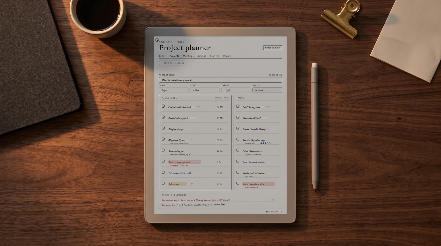 A filled project planner page from our Digital Work Planner on an e-ink tablet on a walnut desk