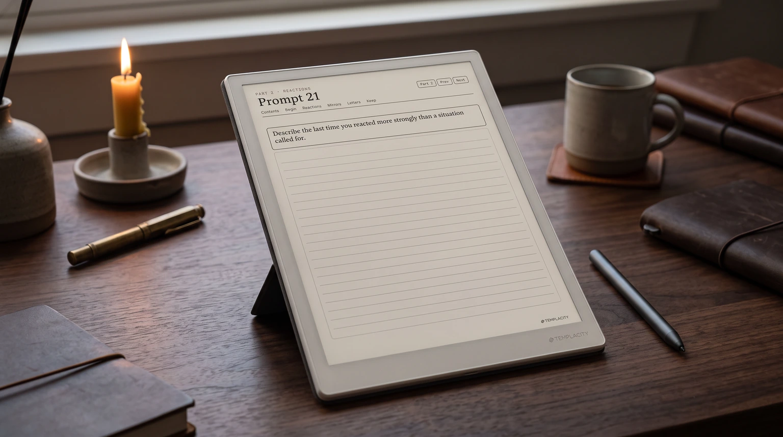A shadow work journal prompt page on an e-ink tablet on a desk at dusk, beside a candle and a mug of tea